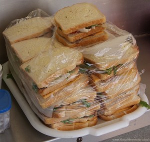 A tray of 20 or so club toasties - bacon, chicken, rocket and cheddar before cooking