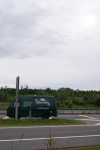 The van, parked up on a junction to the M6 Toll, with his prop shaft hanging out.