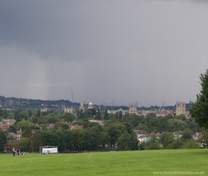 A sheet of rain crawling up the hill of south park towards us.