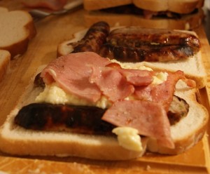 Scrambled egg, bacon and sausage in a toastie