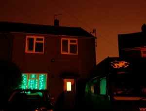 The Beast's green lights have moved into our living room and now illuminate the Beast as he bides his time on the drive