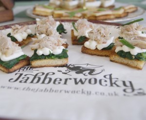 A plate of miniature open toasties, on one of the Wocky bags.