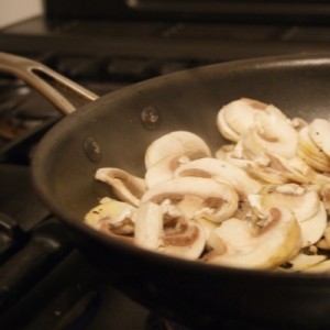 Sliced mushrooms in a frying pan
