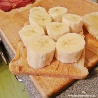 Thick sliced banana on peanut butter and bread