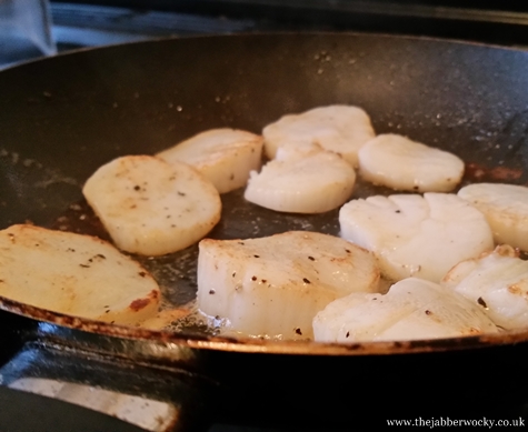 scallops frying in a pan