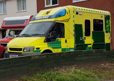 A box-backed ambulance on our driveway.